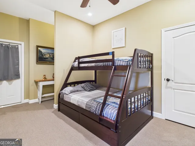a room with pool table and windows