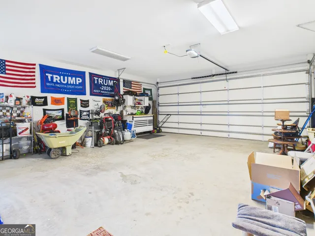 a kitchen with granite countertop a sink and a refrigerator