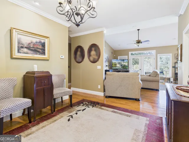a view of a bedroom with furniture window and wooden floor