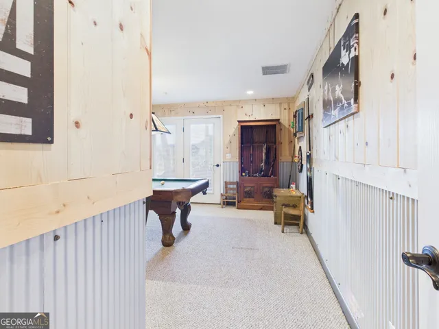 a living room with stainless steel appliances kitchen island granite countertop furniture a kitchen view and a refrigerator