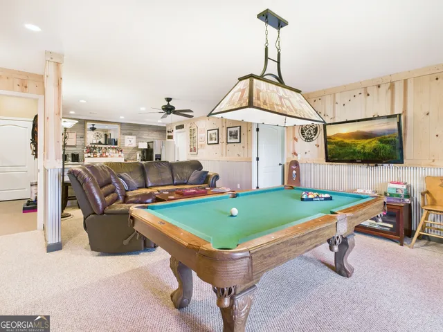 a view of a swimming pool with chairs