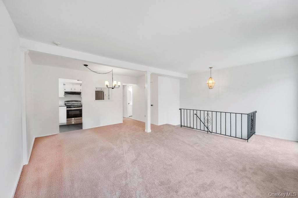 85 Rocky Point Yaphank Road, Unit 168 Rocky Point, NY 11778 - Photo 13 of 32 a view of an empty room with a window