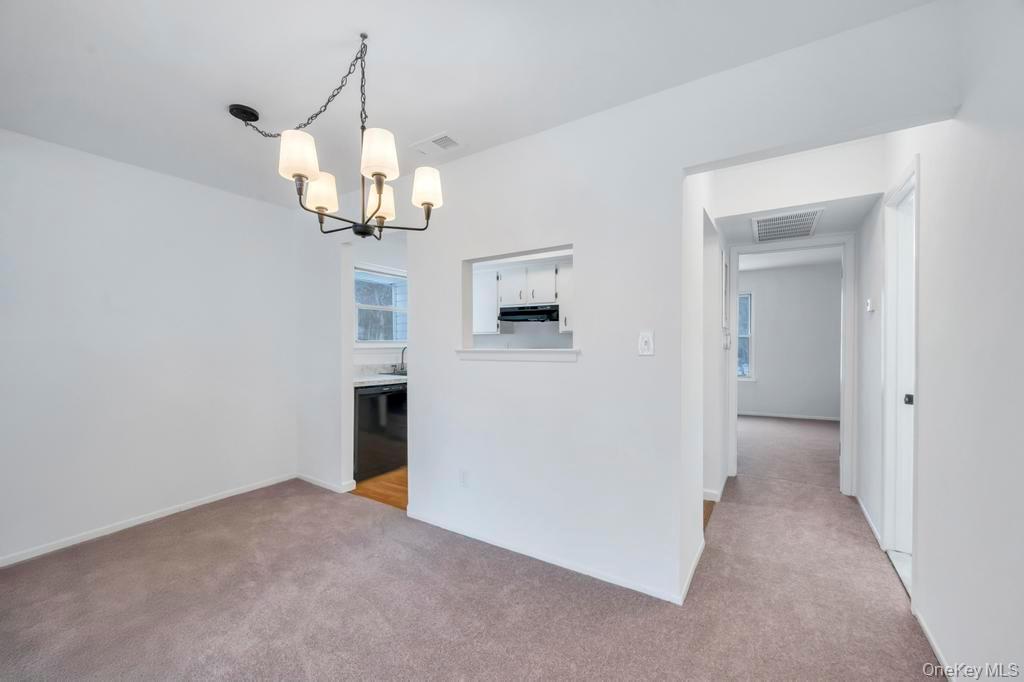 85 Rocky Point Yaphank Road, Unit 168 Rocky Point, NY 11778 - Photo 15 of 32 a view of a chandelier in a room