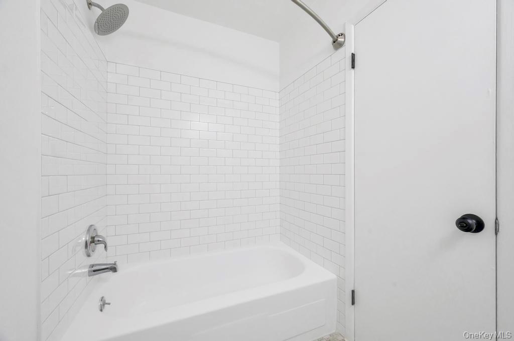 85 Rocky Point Yaphank Road, Unit 168 Rocky Point, NY 11778 - Photo 23 of 32 a close up of a bathtub curtain