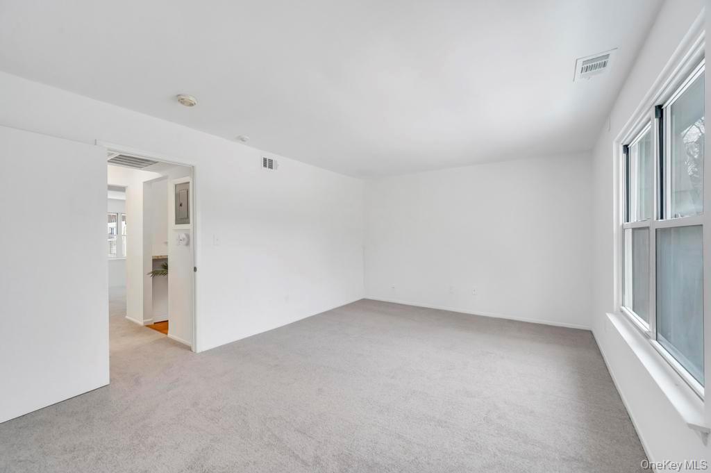 85 Rocky Point Yaphank Road, Unit 168 Rocky Point, NY 11778 - Photo 25 of 32 an empty room with a empty space