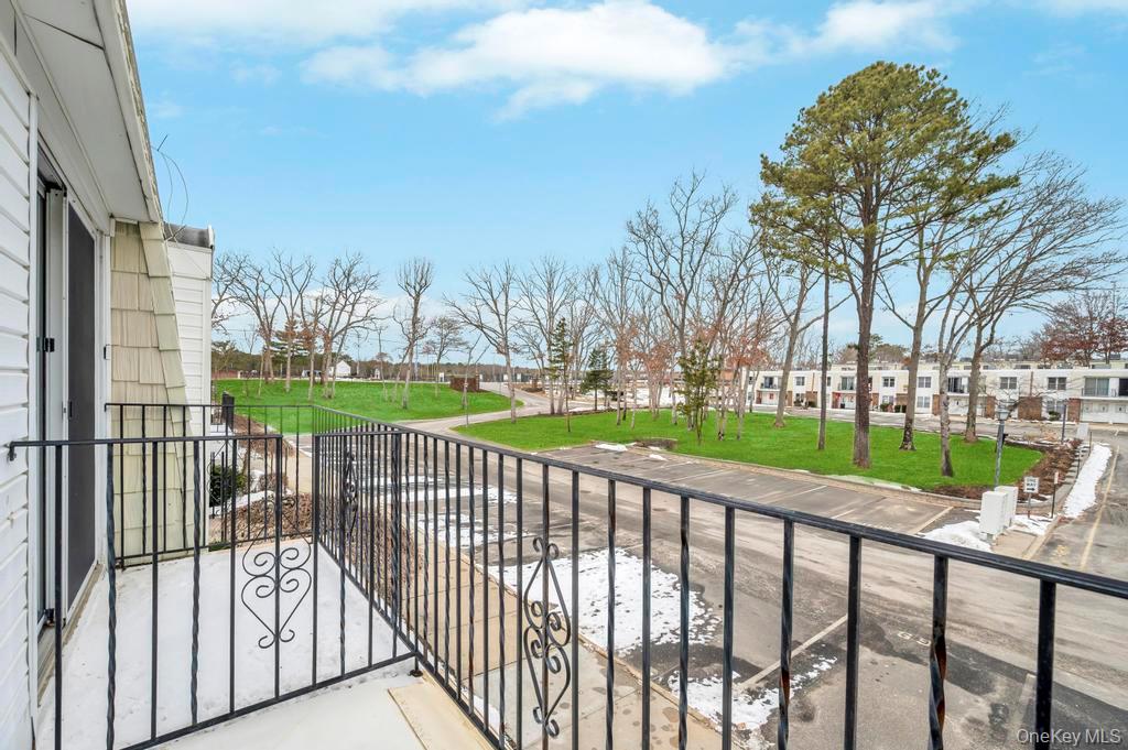 85 Rocky Point Yaphank Road, Unit 168 Rocky Point, NY 11778 - Photo 29 of 32 a view of a backyard with a garden