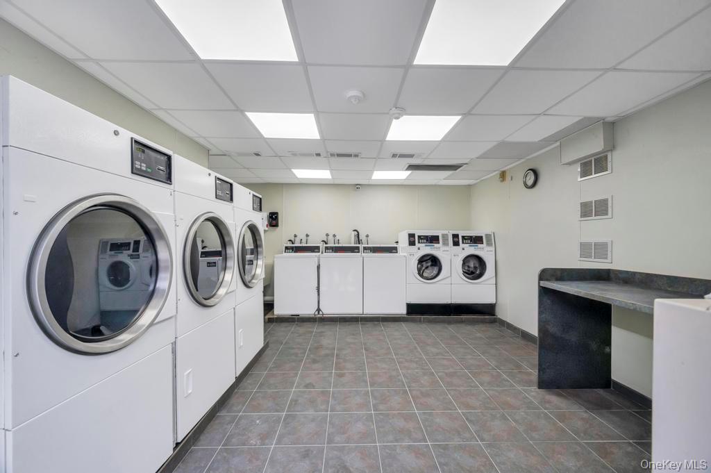 85 Rocky Point Yaphank Road, Unit 168 Rocky Point, NY 11778 - Photo 30 of 32 a view of a storage & utility room with two washing machine