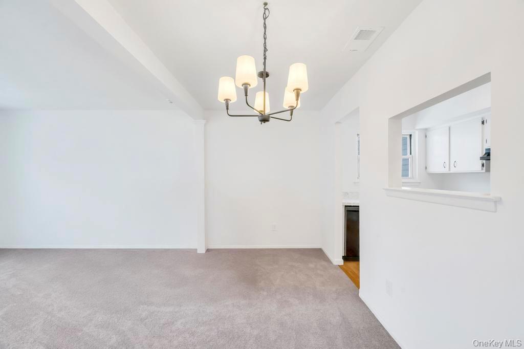 85 Rocky Point Yaphank Road, Unit 168 Rocky Point, NY 11778 - Photo 8 of 32 a view of a room with wooden floor