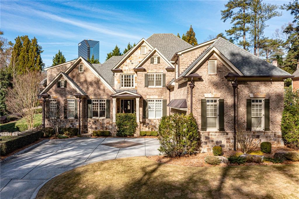 972 Canter Road Northeast Atlanta, GA 30324 - Photo 1 of 1 a view of a white house with a large windows and a yard