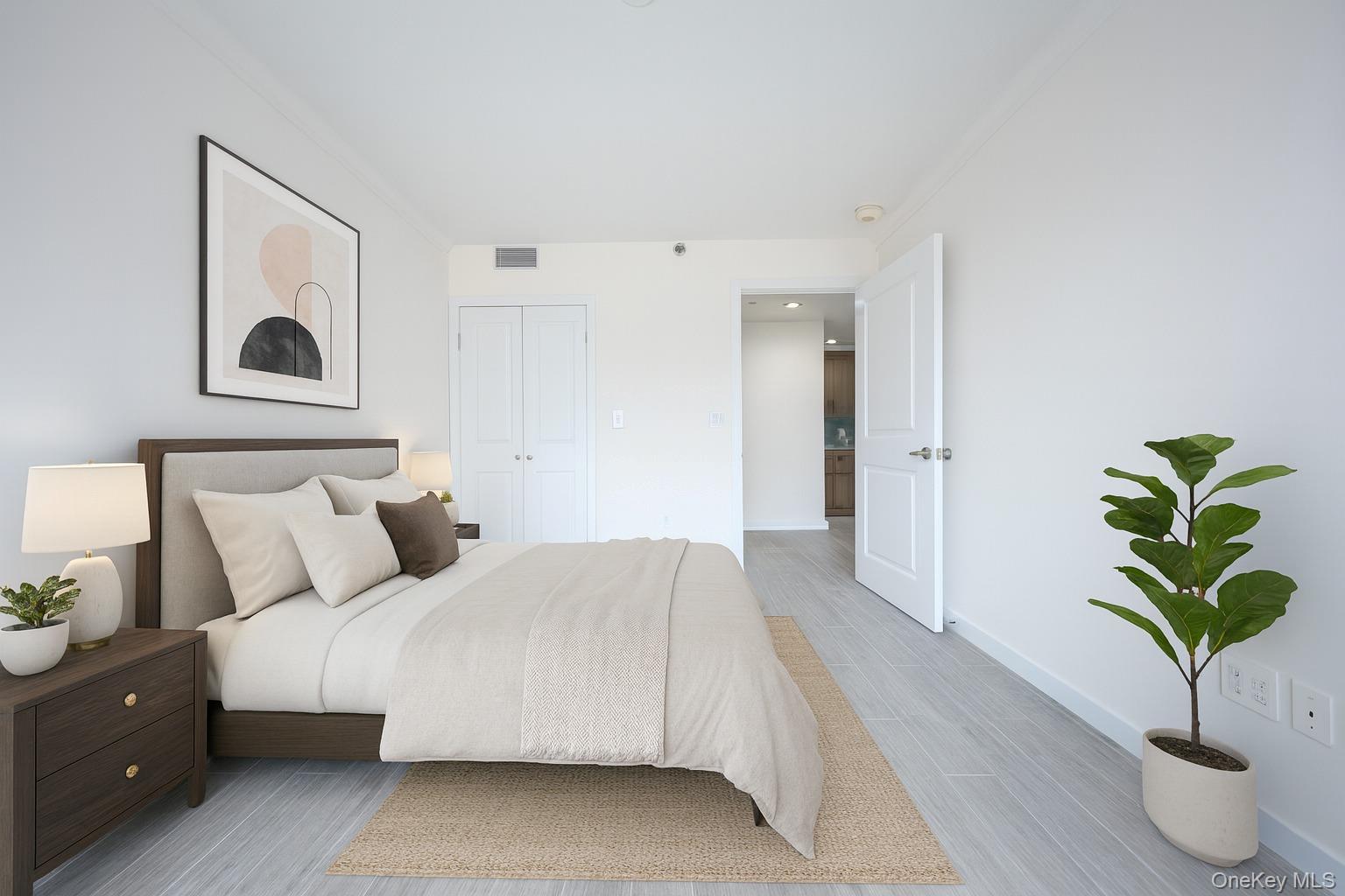 132-27 41st Road, Unit 4A Queens, NY 11355 - Photo 12 of 17 Bedroom with wood finished floors, crown molding, and a closet