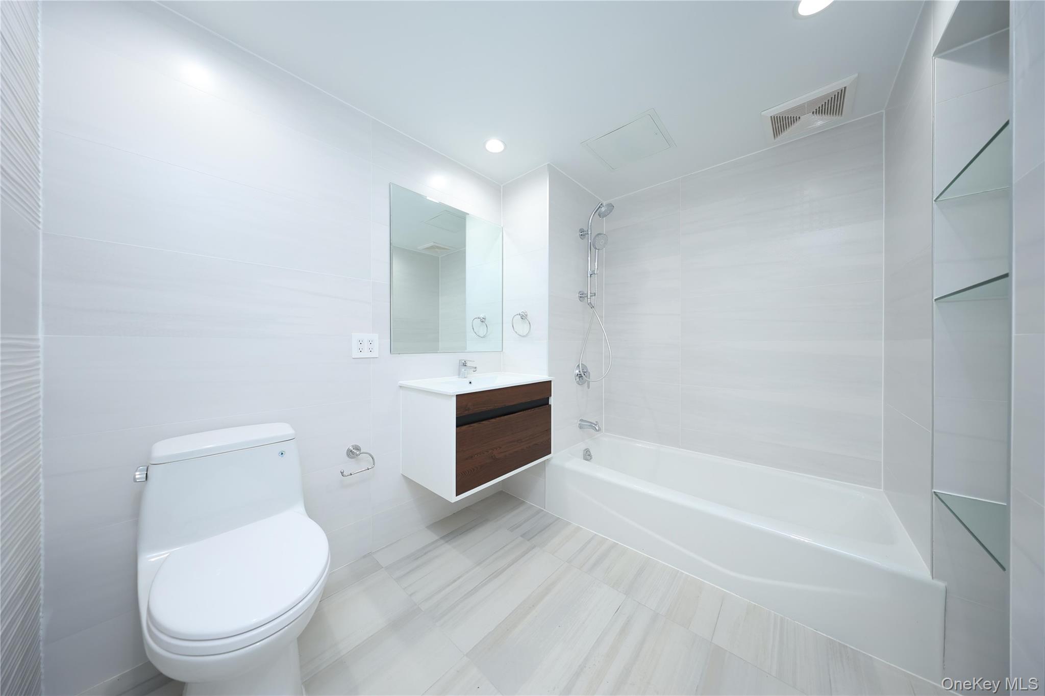 132-27 41st Road, Unit 4A Queens, NY 11355 - Photo 13 of 17 Full bathroom with bathtub / shower combination, vanity, and recessed lighting