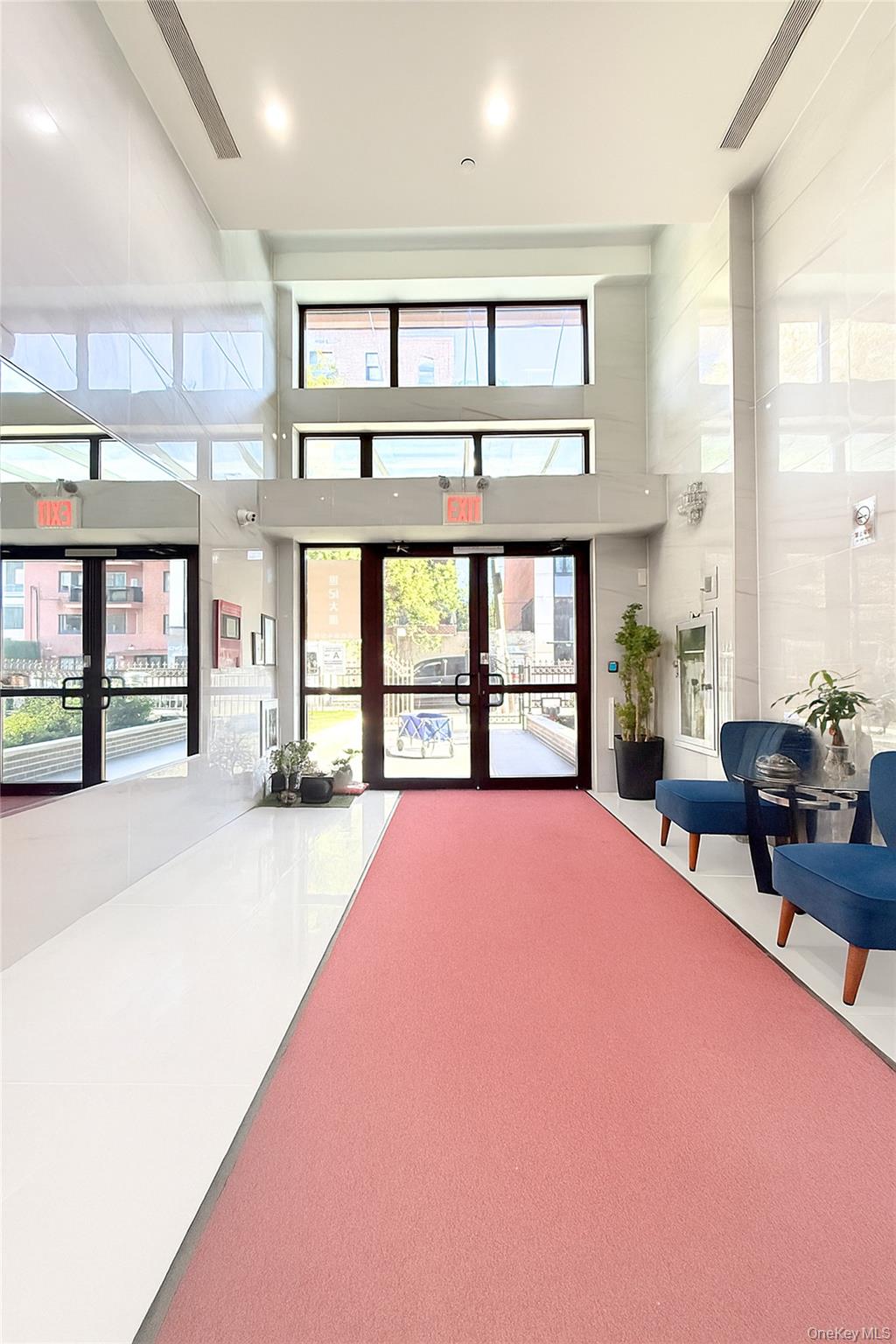 132-27 41st Road, Unit 4A Queens, NY 11355 - Photo 4 of 17 Community lobby featuring a towering ceiling and recessed lighting