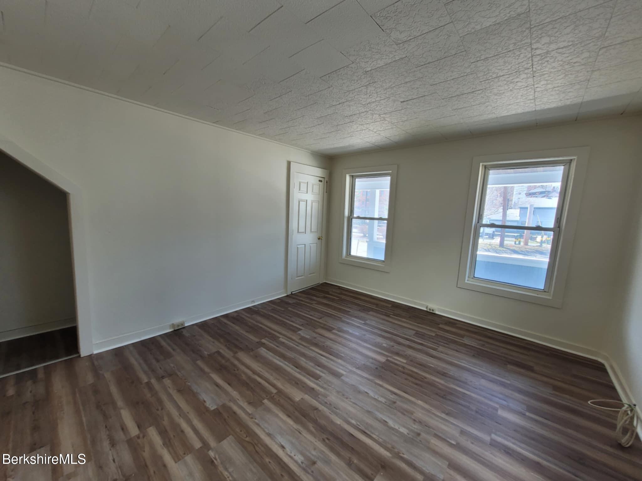 35 Pleasant Street Adams, MA 01220 - Photo 5 of 7 wooden floor in an empty room with a window