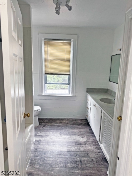 53 Hille Place, Unit 2 Ridgefield Park, NJ 07660 - Photo 6 of 9 a bathroom with a granite countertop sink toilet and shower