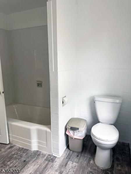 53 Hille Place, Unit 2 Ridgefield Park, NJ 07660 - Photo 8 of 9 a white toilet sitting next to a bath tub