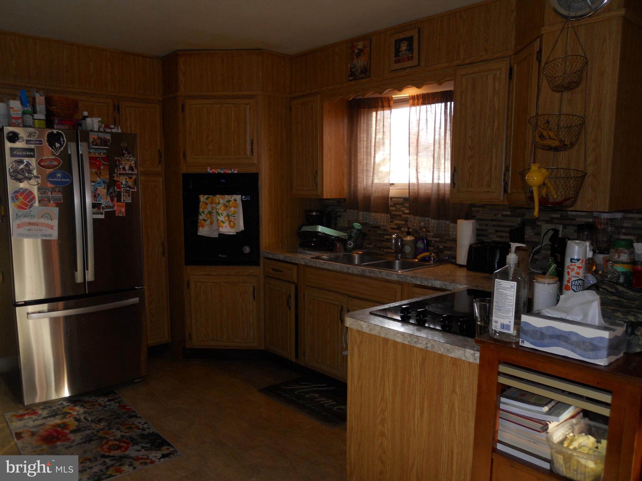 164 Oberlin Avenue Reading, PA 19608 - Photo 11 of 31 a kitchen with a refrigerator and a stove top oven