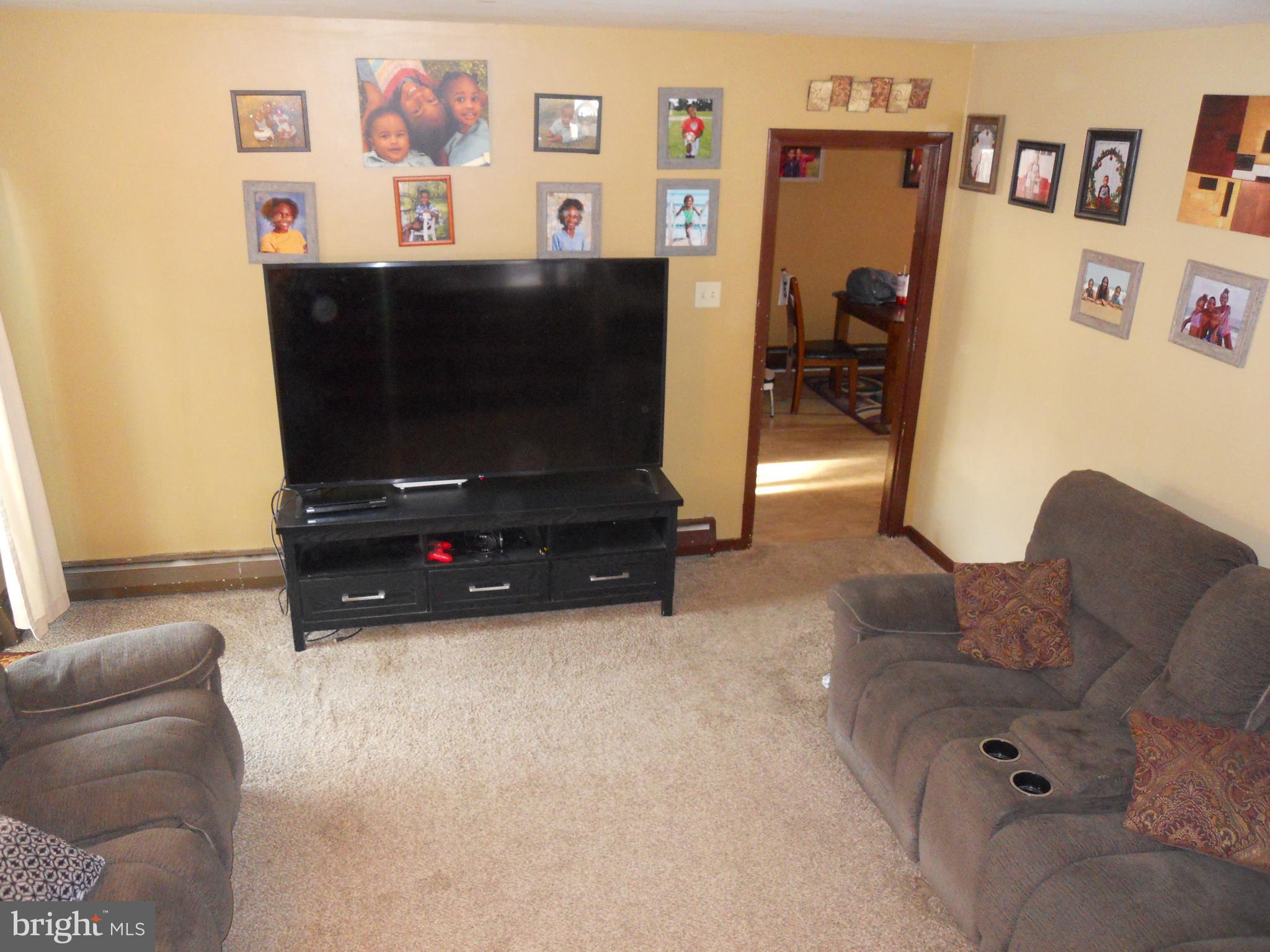 164 Oberlin Avenue Reading, PA 19608 - Photo 13 of 31 a living room with furniture and a flat screen tv