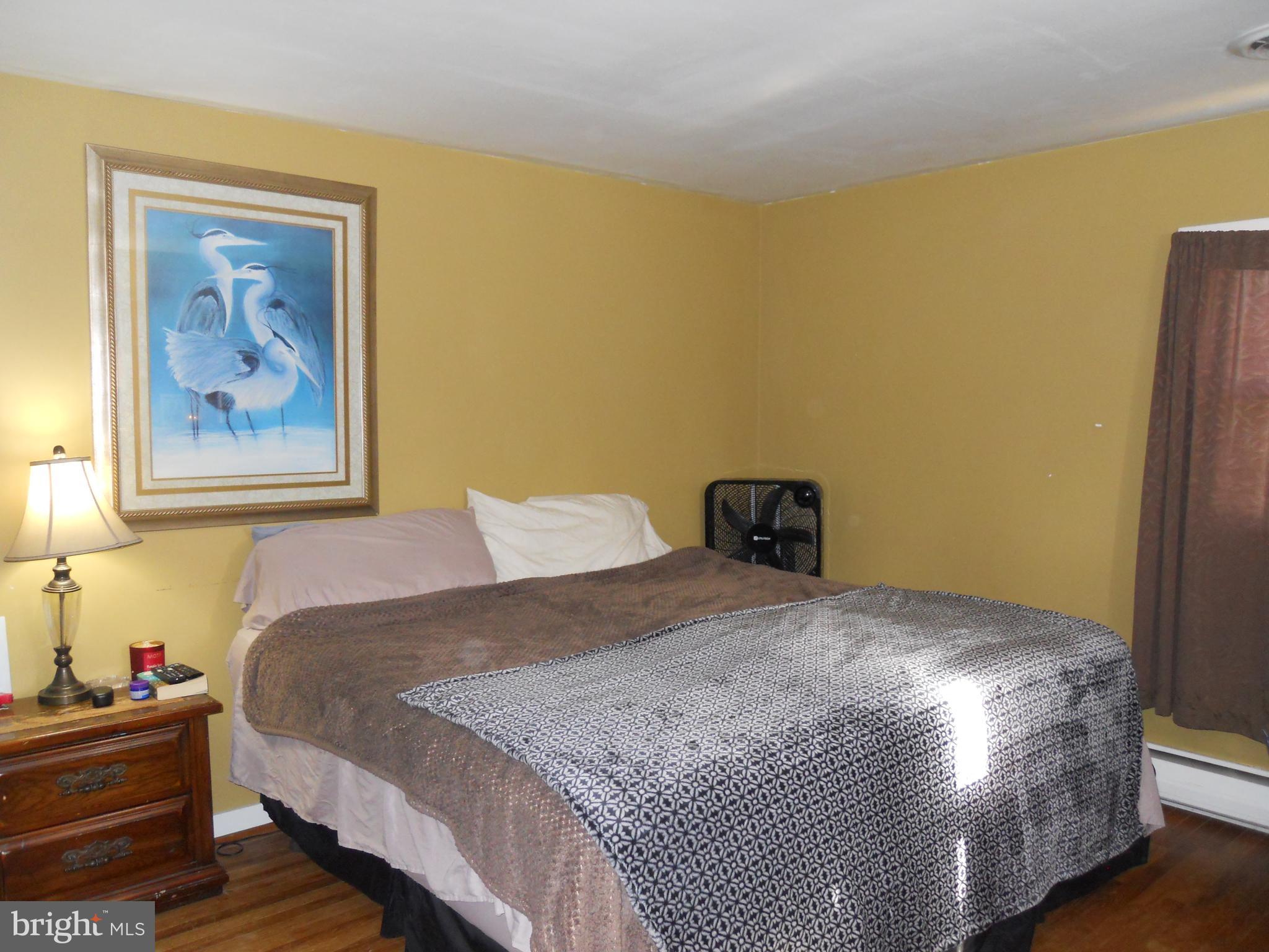 164 Oberlin Avenue Reading, PA 19608 - Photo 18 of 31 a bedroom with a bed and a painting on the wall