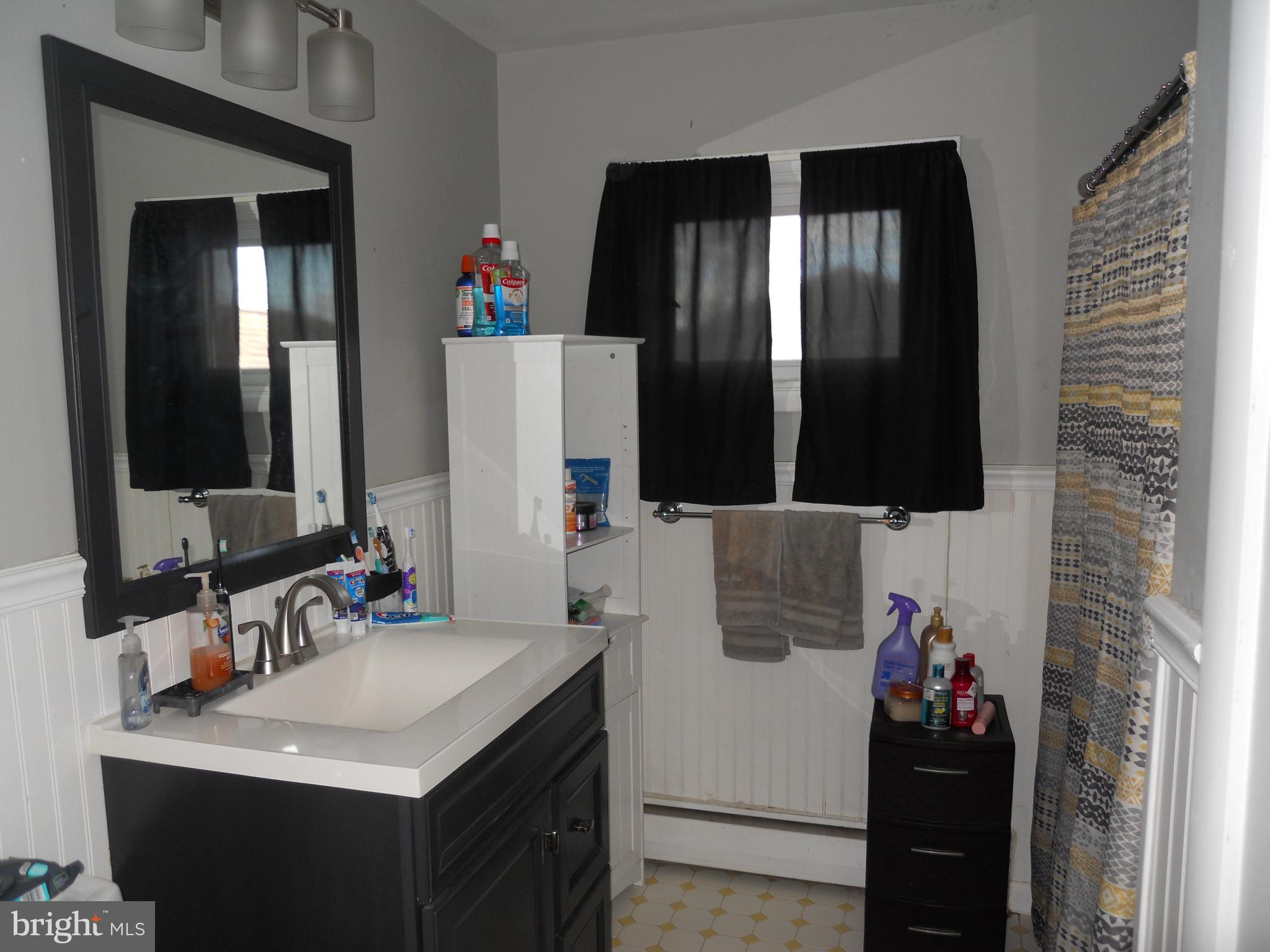164 Oberlin Avenue Reading, PA 19608 - Photo 20 of 31 a bathroom with a sink and a mirror
