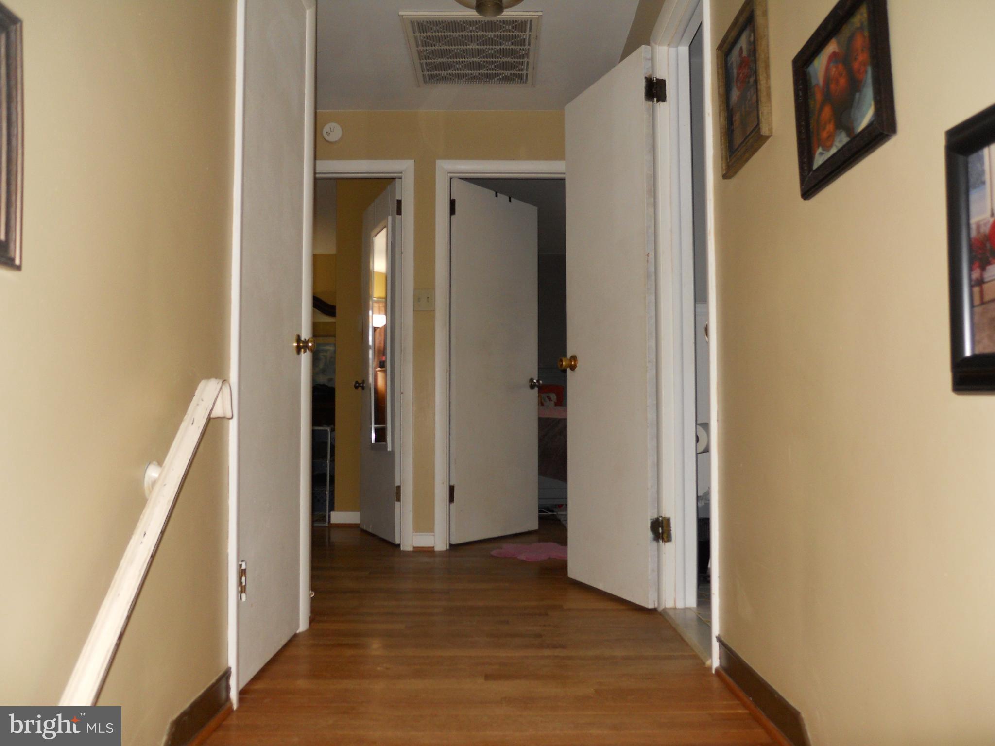164 Oberlin Avenue Reading, PA 19608 - Photo 21 of 31 a view of a hallway with wooden floor and staircase