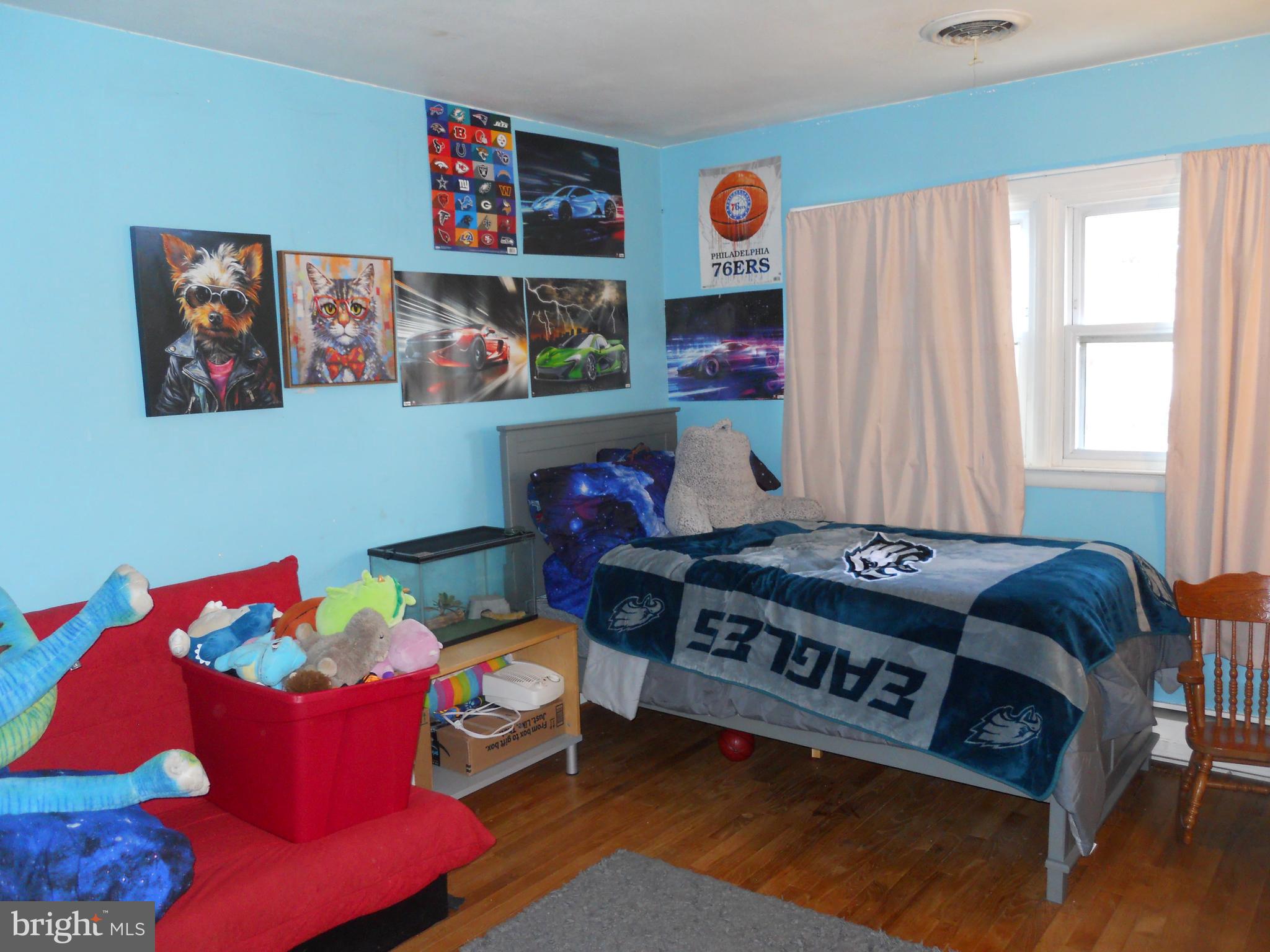164 Oberlin Avenue Reading, PA 19608 - Photo 25 of 31 a living room with furniture and a baby crib