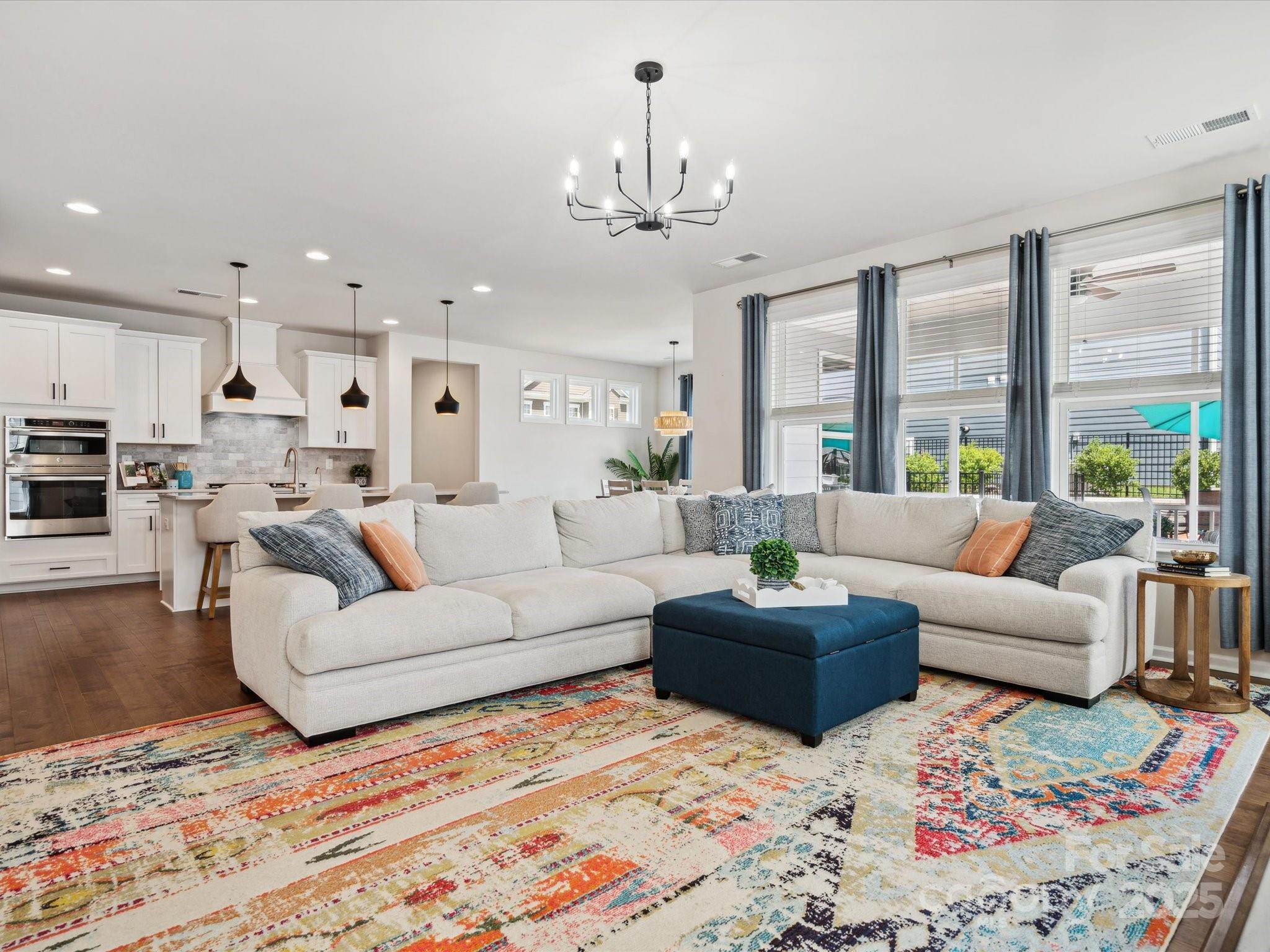 924 Stebbins Drive Fort Mill, SC 29715 - Photo 11 of 48 a living room with furniture and a chandelier