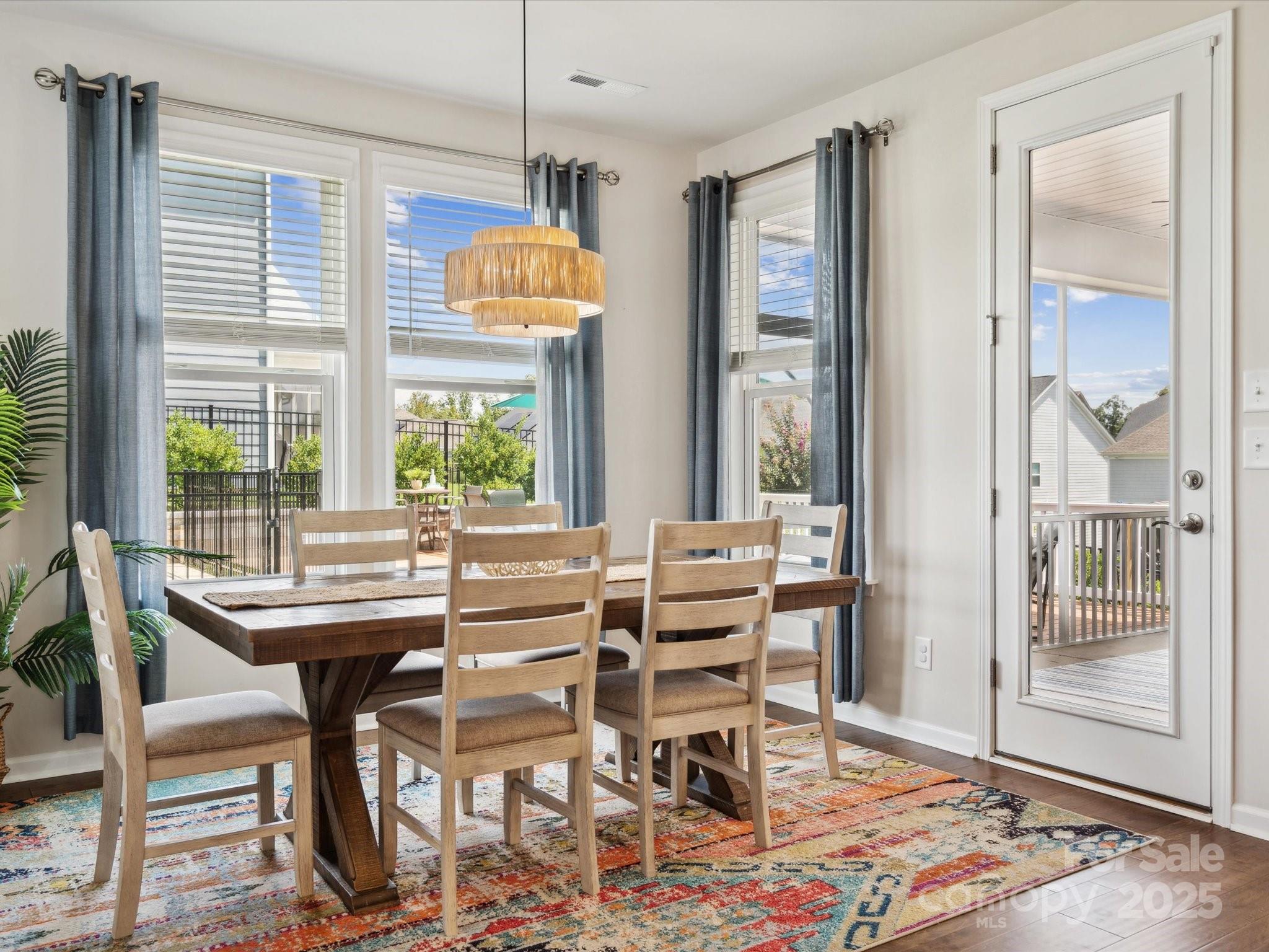 924 Stebbins Drive Fort Mill, SC 29715 - Photo 18 of 48 a dining room with furniture a chandelier and wooden floor