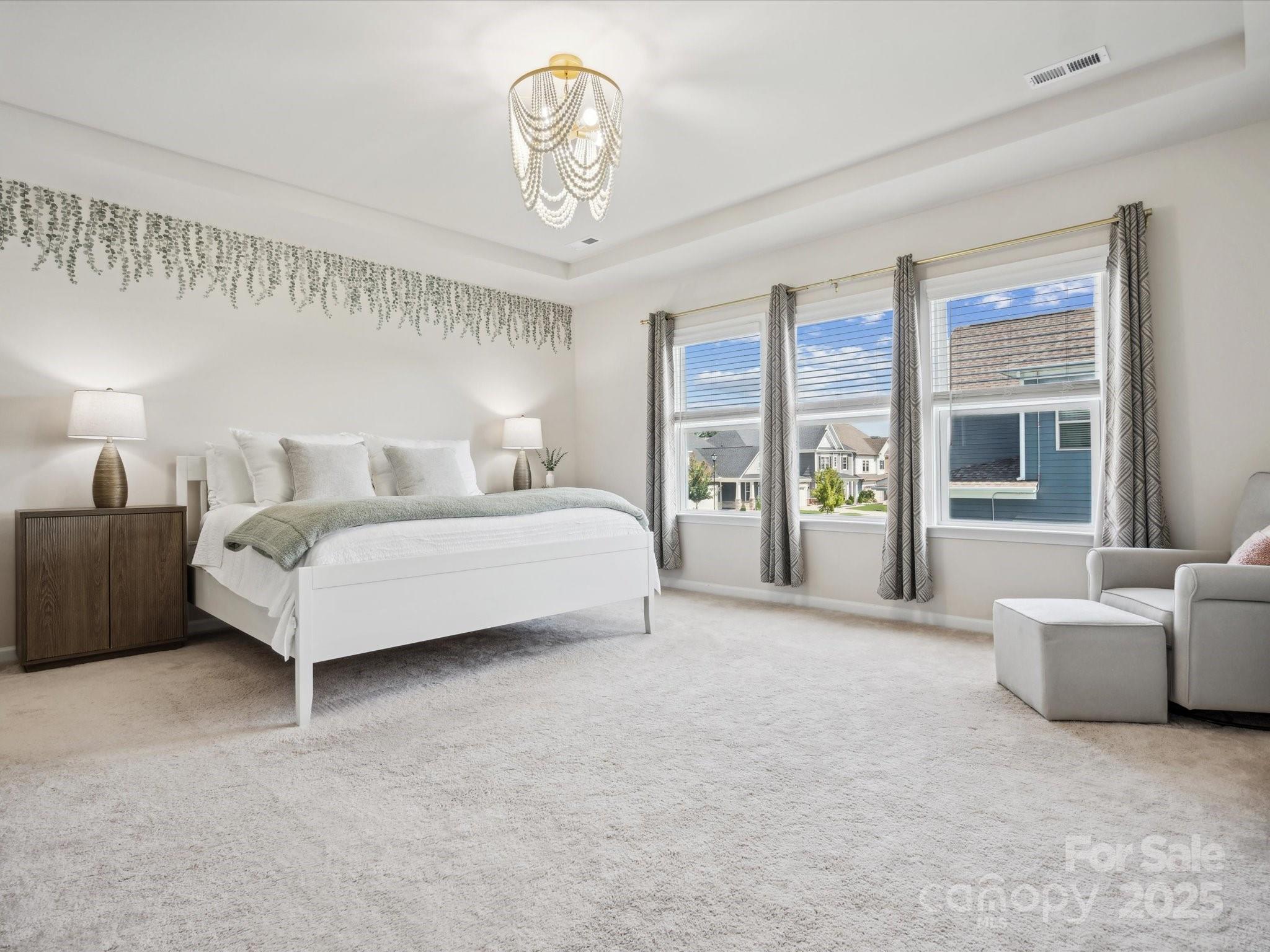 924 Stebbins Drive Fort Mill, SC 29715 - Photo 19 of 48 a spacious bedroom with a bed couch and window
