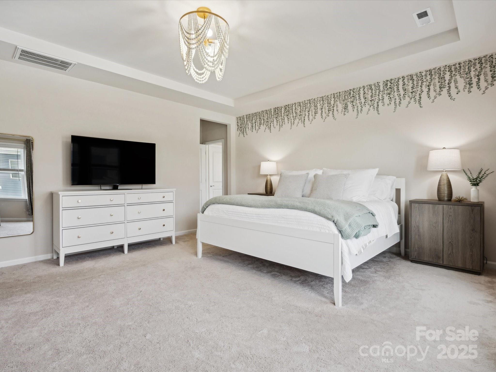924 Stebbins Drive Fort Mill, SC 29715 - Photo 20 of 48 a spacious bedroom with a bed and a flat screen tv