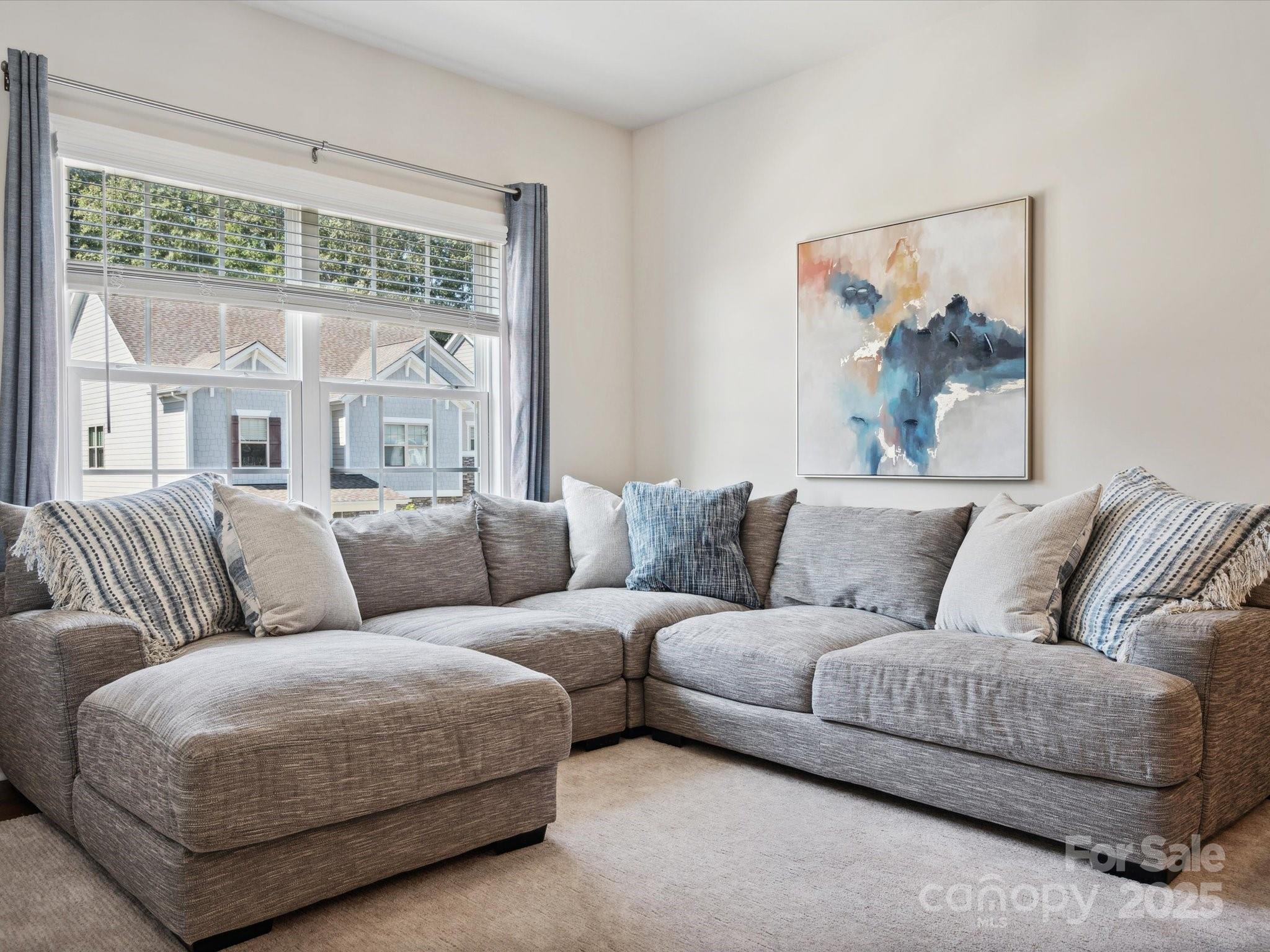 924 Stebbins Drive Fort Mill, SC 29715 - Photo 26 of 48 a living room with furniture and a large window