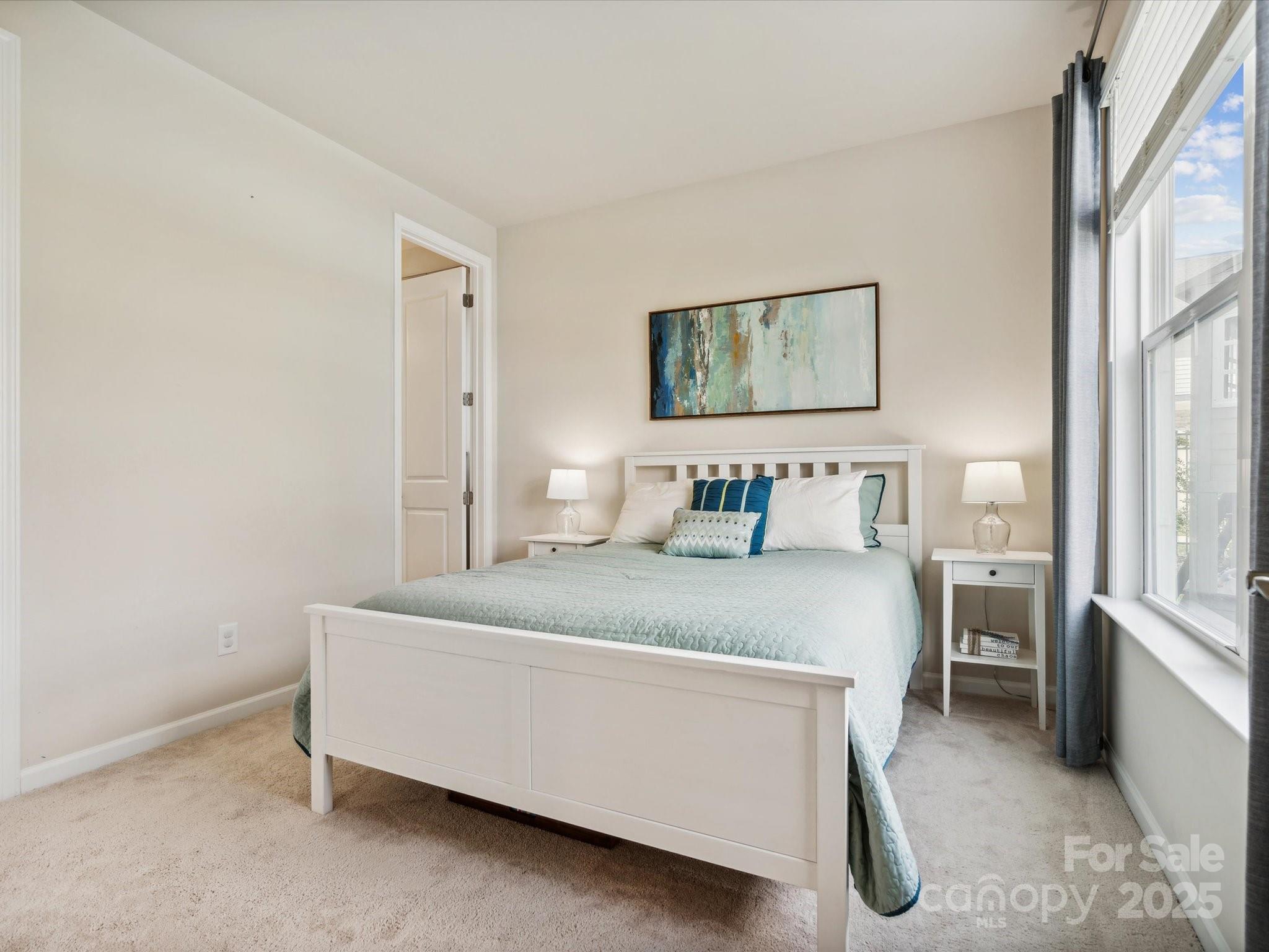 924 Stebbins Drive Fort Mill, SC 29715 - Photo 27 of 48 a bedroom with a bed and a window