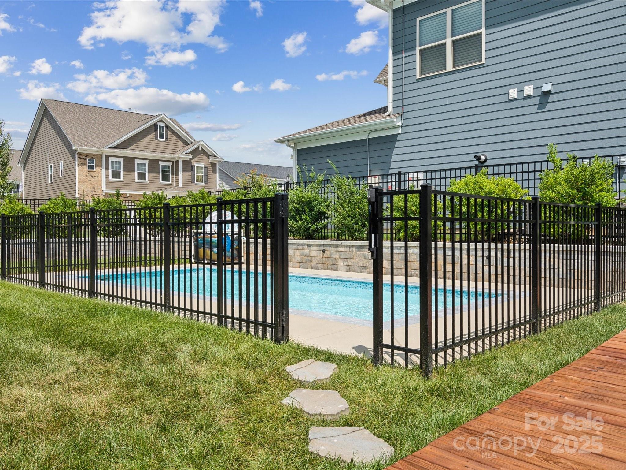 924 Stebbins Drive Fort Mill, SC 29715 - Photo 38 of 48 a view of a white house in the back yard of a house