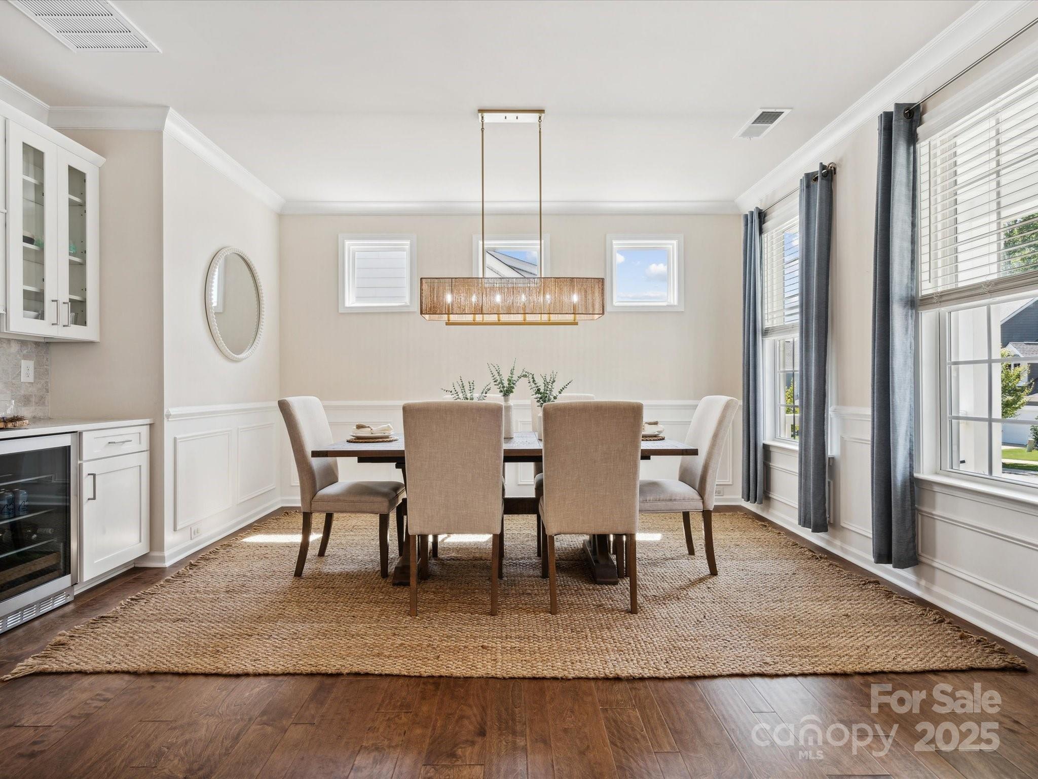 924 Stebbins Drive Fort Mill, SC 29715 - Photo 6 of 48 a view of a dining room with furniture window and wooden floor