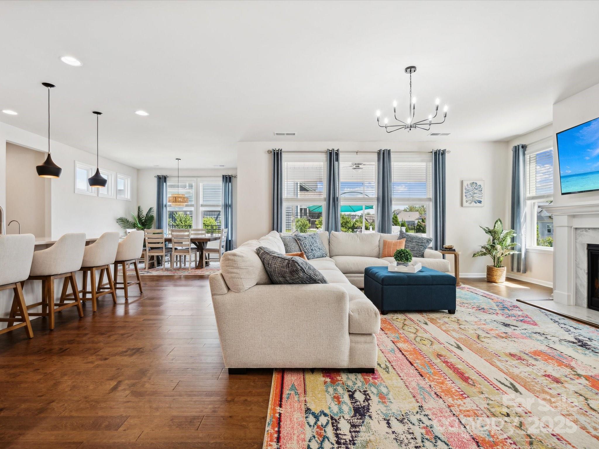 924 Stebbins Drive Fort Mill, SC 29715 - Photo 9 of 48 a living room with furniture and a chandelier