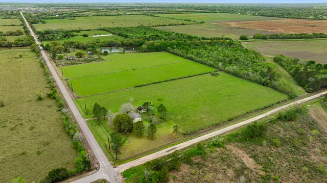 a view of a field with an ocean view