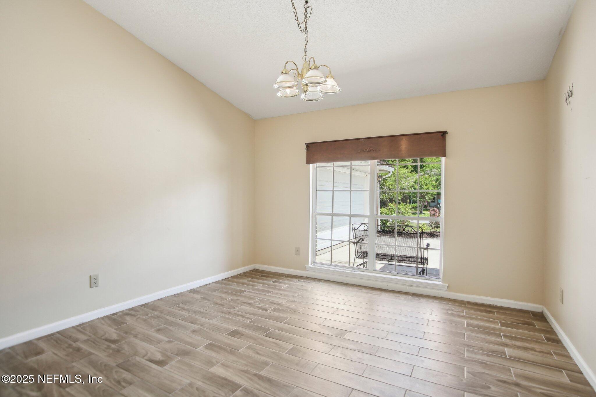 1634 Dockside Drive Fleming Island, FL 32003 - Photo 13 of 44 wooden floor in an empty room with a window