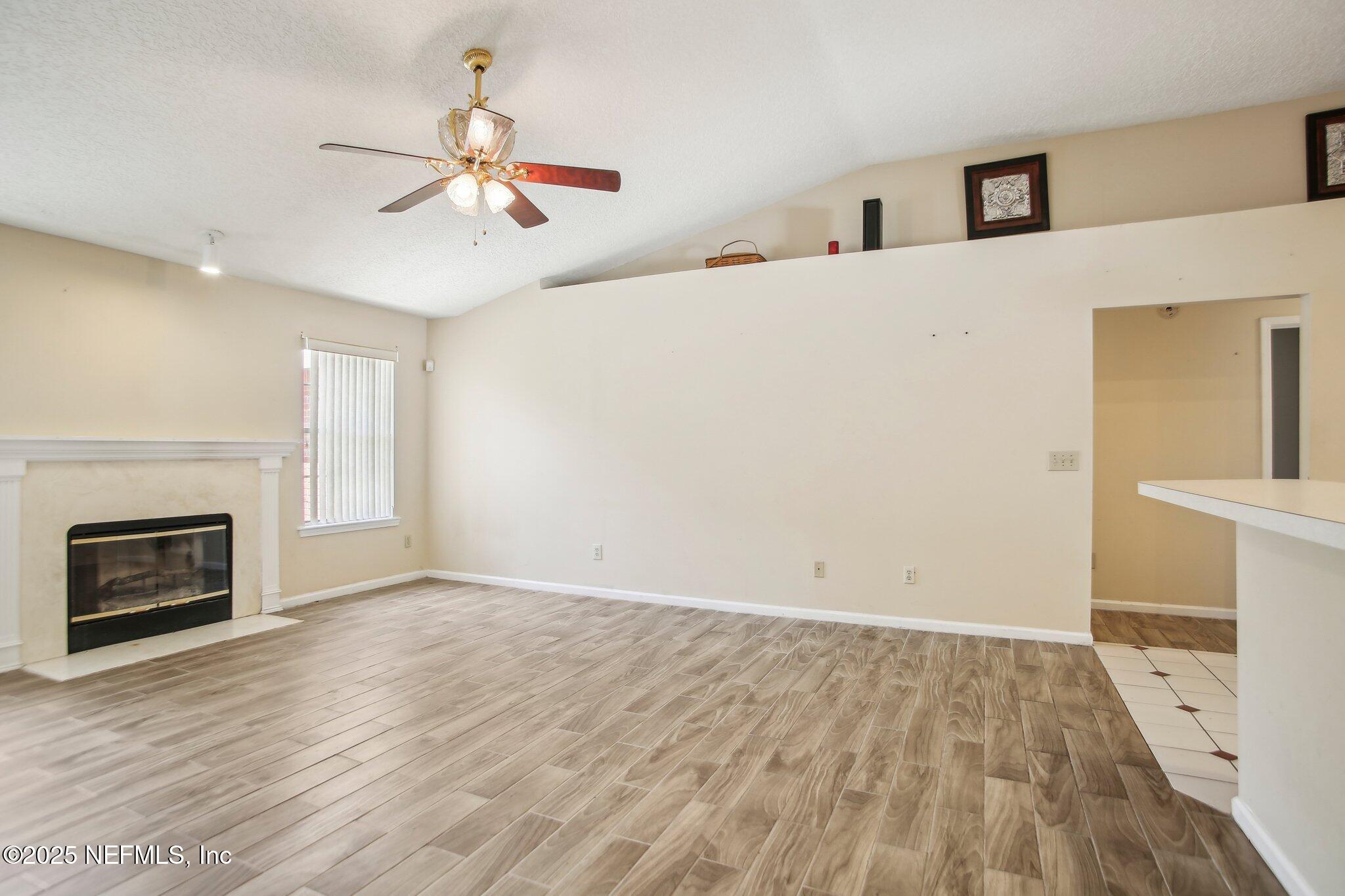 1634 Dockside Drive Fleming Island, FL 32003 - Photo 14 of 44 a view of an empty room and fire place
