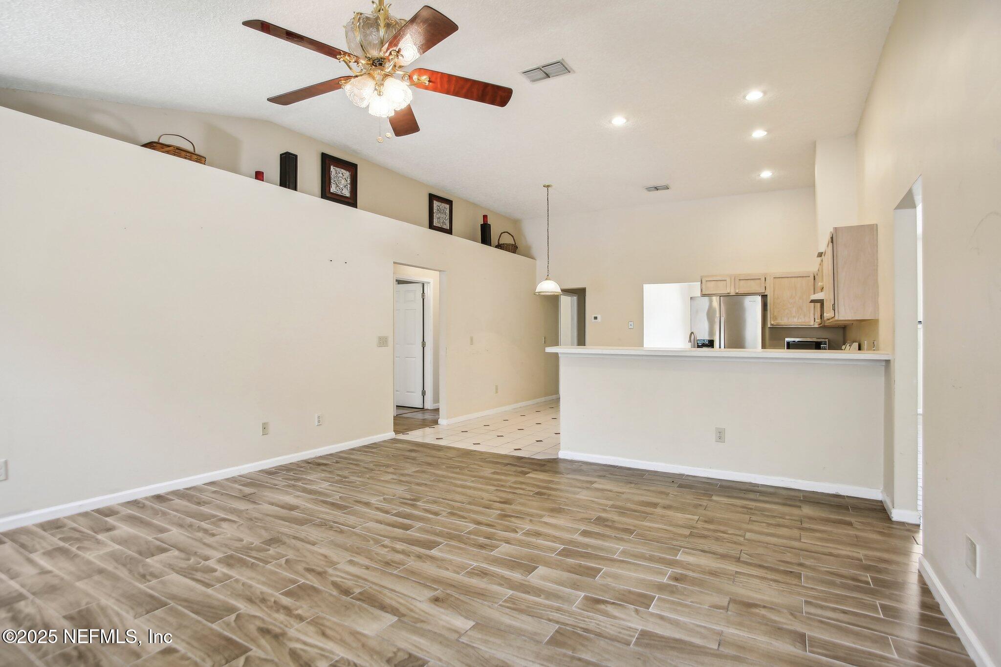 1634 Dockside Drive Fleming Island, FL 32003 - Photo 17 of 44 a view of a kitchen with a sink and a refrigerator