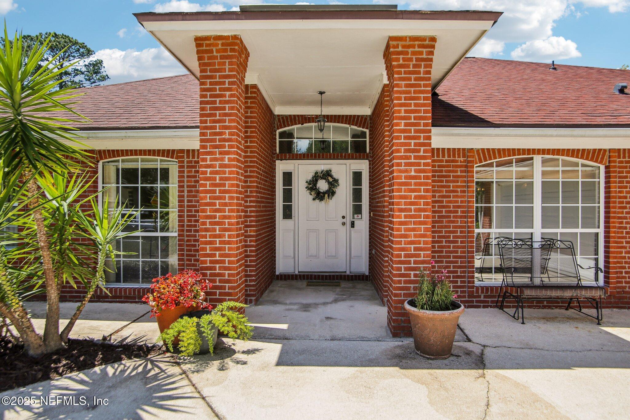 1634 Dockside Drive Fleming Island, FL 32003 - Photo 3 of 44 a front view of a house with sitting area
