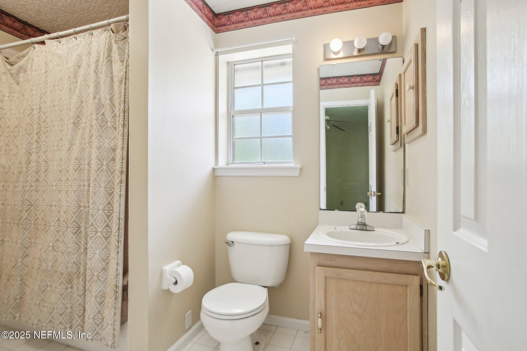1634 Dockside Drive Fleming Island, FL 32003 - Photo 35 of 44 a bathroom with a sink a toilet and shower