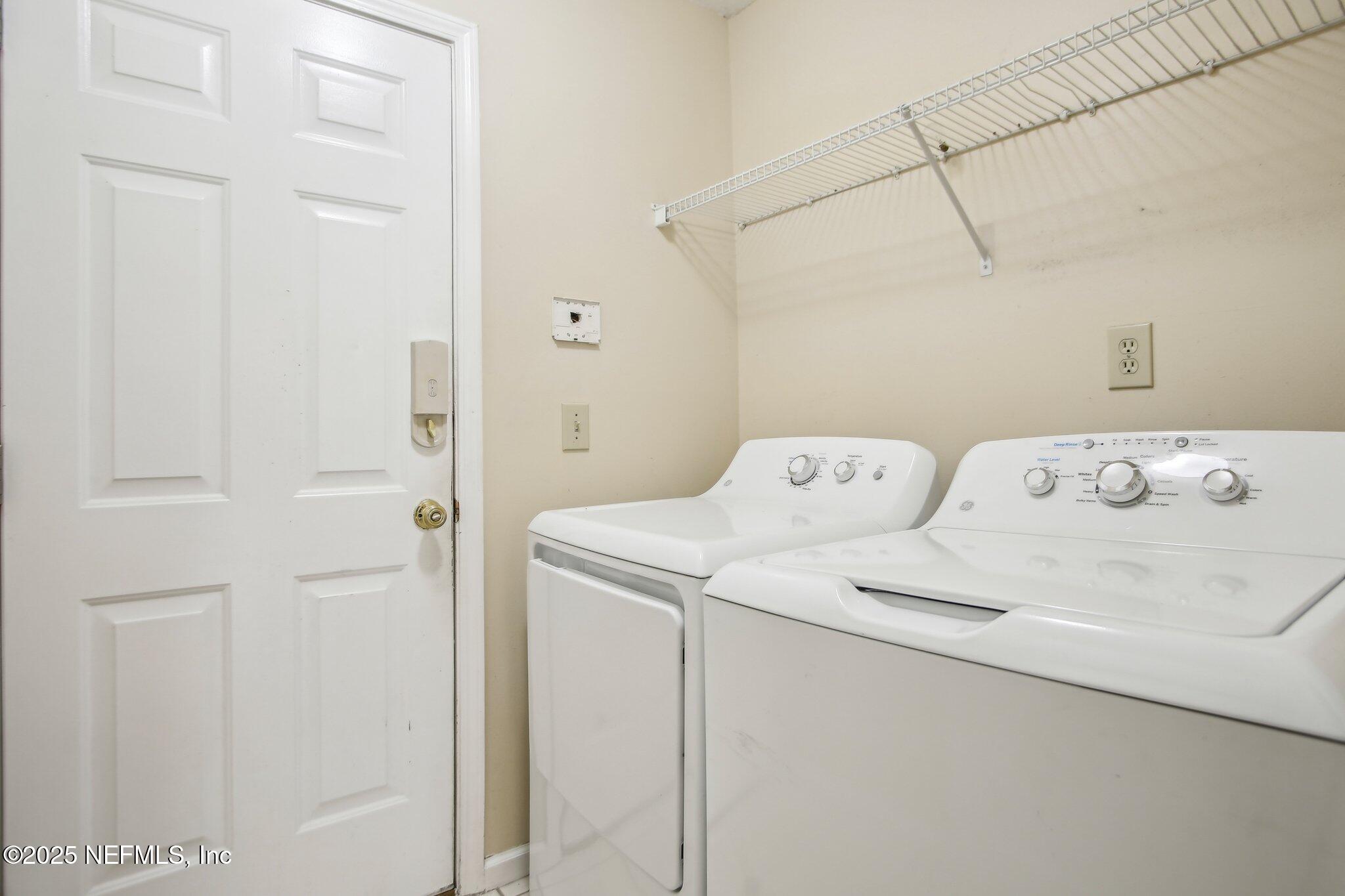 1634 Dockside Drive Fleming Island, FL 32003 - Photo 37 of 44 a utility room with dryer and washer