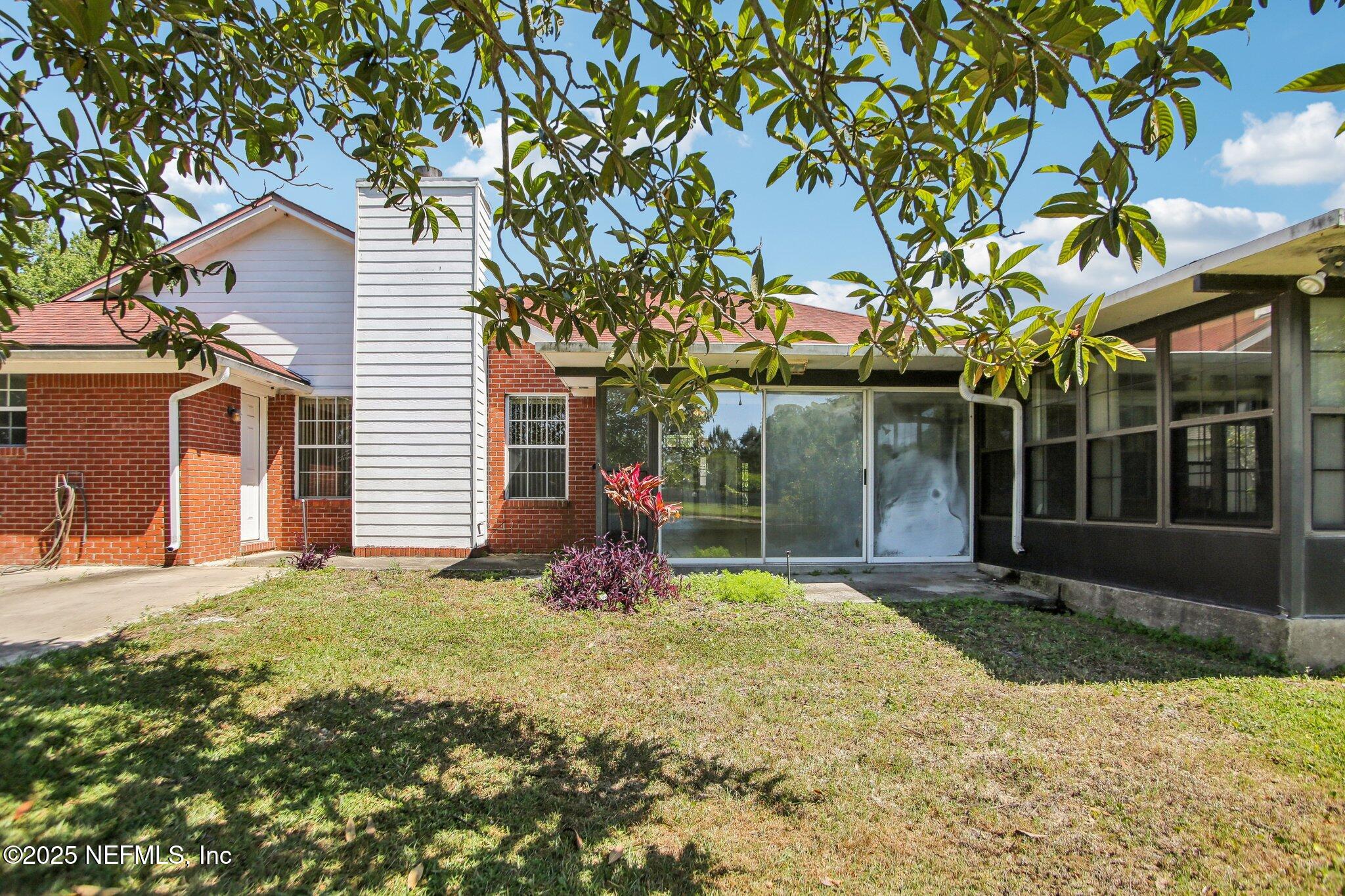 1634 Dockside Drive Fleming Island, FL 32003 - Photo 41 of 44 a view of a house with a yard and large tree