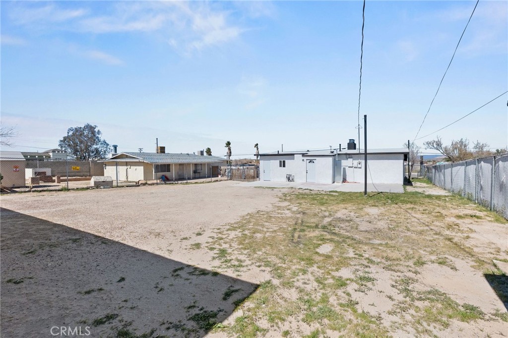 25441 Main Street Barstow, CA 92311 - Photo 32 of 66 a view of swimming pool with a yard