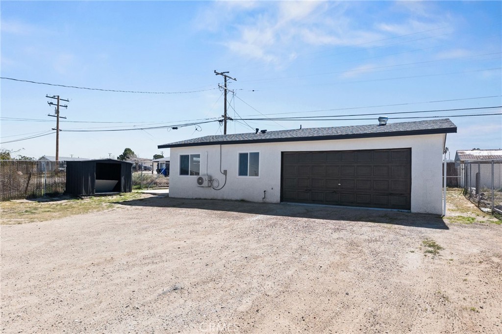 25441 Main Street Barstow, CA 92311 - Photo 33 of 66 a front view of a house with a yard