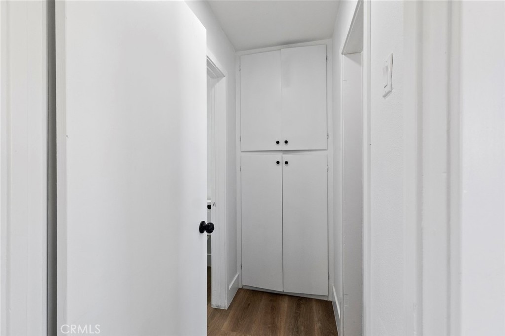 25441 Main Street Barstow, CA 92311 - Photo 51 of 66 a view of a hallway with wooden floor