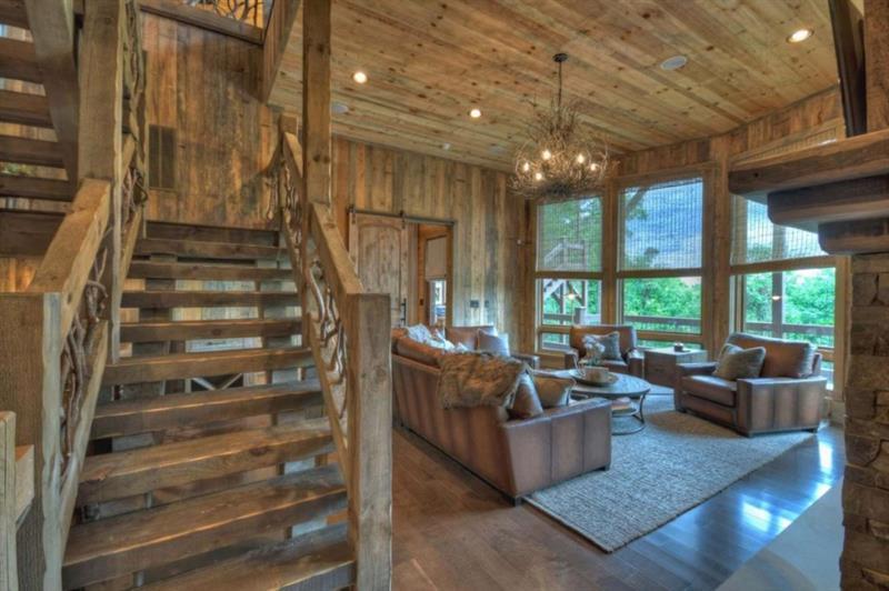 436 Geronimo Road Cherry Log, GA 30522 - Photo 41 of 72 a living room with furniture and a chandelier