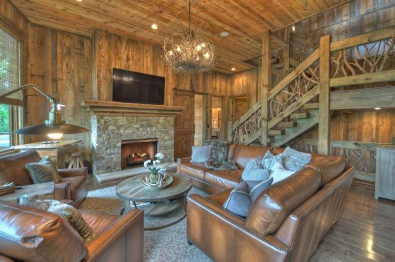 436 Geronimo Road Cherry Log, GA 30522 - Photo 42 of 72 a living room with furniture a flat screen tv and a fireplace