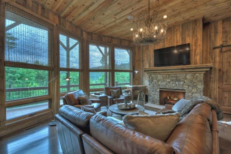 436 Geronimo Road Cherry Log, GA 30522 - Photo 43 of 72 a living room with furniture a flat screen tv and a fireplace