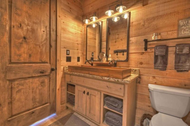 436 Geronimo Road Cherry Log, GA 30522 - Photo 46 of 72 a bathroom with a granite countertop sink a toilet and a shower