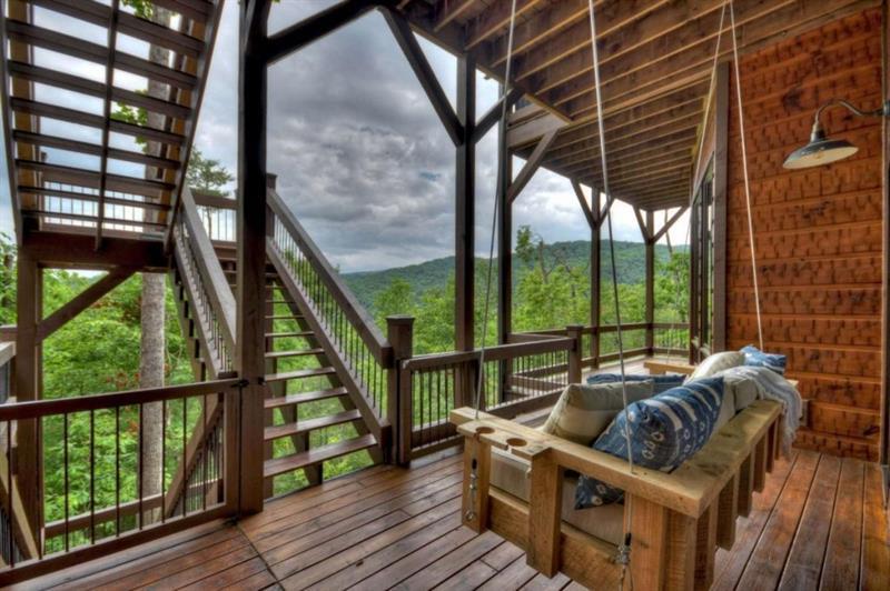 436 Geronimo Road Cherry Log, GA 30522 - Photo 64 of 72 a view of balcony with couch and wooden floor